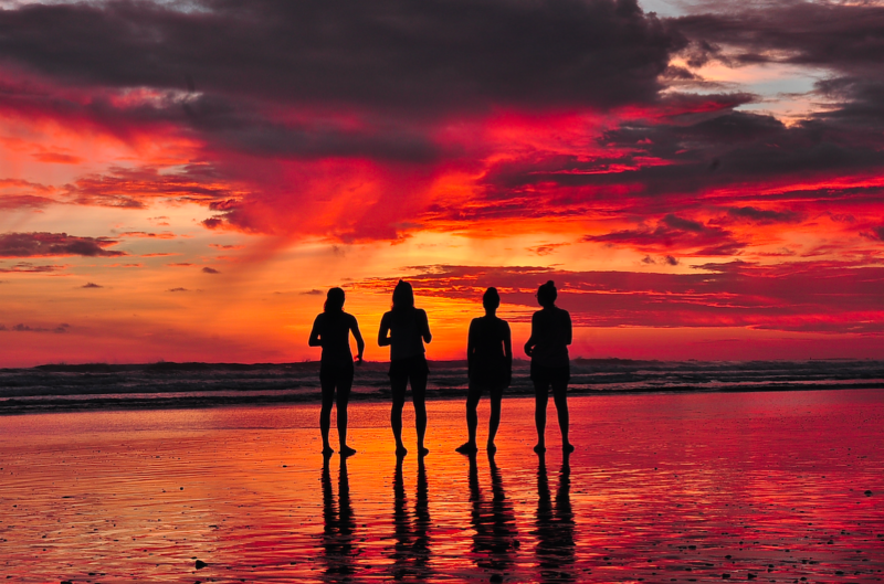 ladies-standing-at-beach-during-sunset-costa-rica-photo-by-michael fernandez
